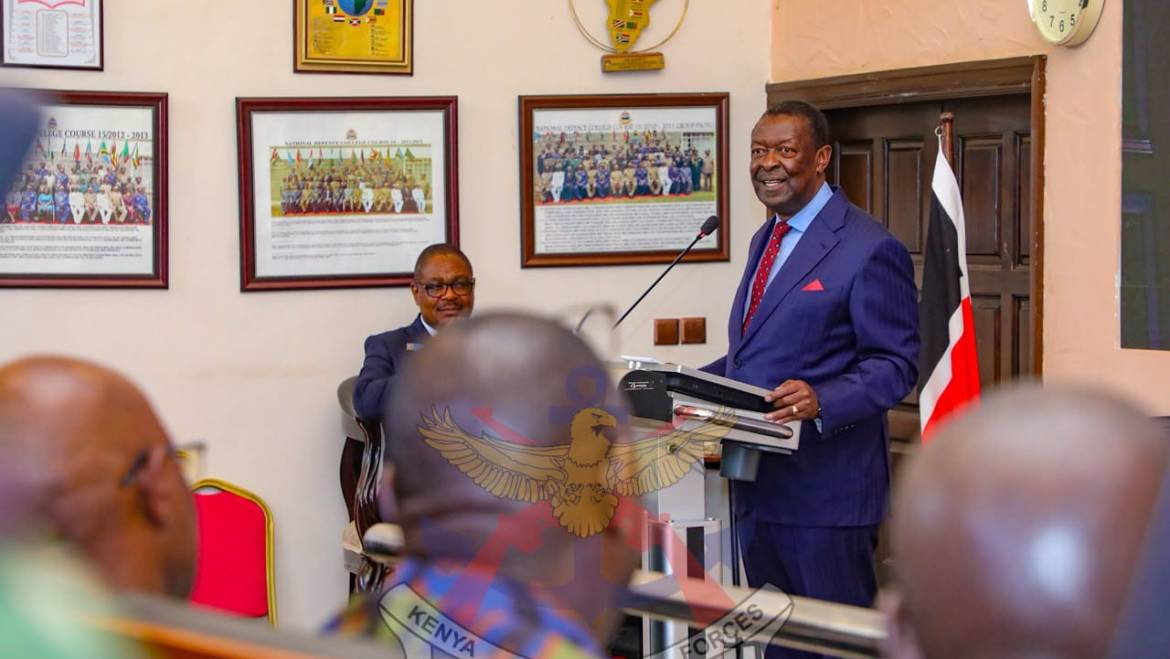 Musalia Mudavadi speaking at a lectern at the National Defence College