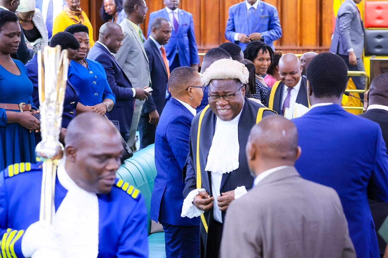 Speaker Jacob Marksons Oboth in ceremonial robes among colleagues after a sitting of Uganda’s Parliament.